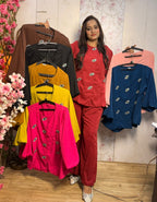 Tailored tunic top with premium jewel brooch/motifs paired with comfortable wide-leg trousers