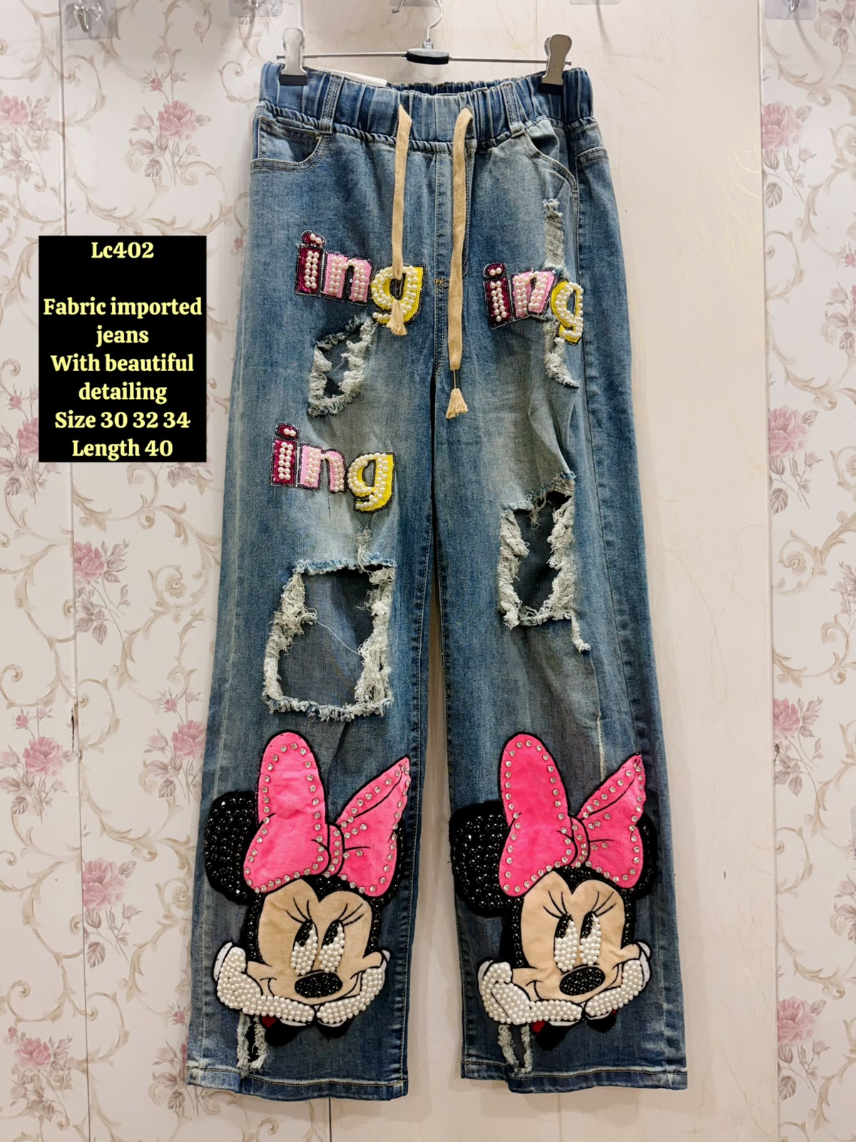 Women Blue Ripped Imported Denim Jeans with Cartoon Bow & Letter Patches